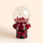 Black box, red roses, gold flakes