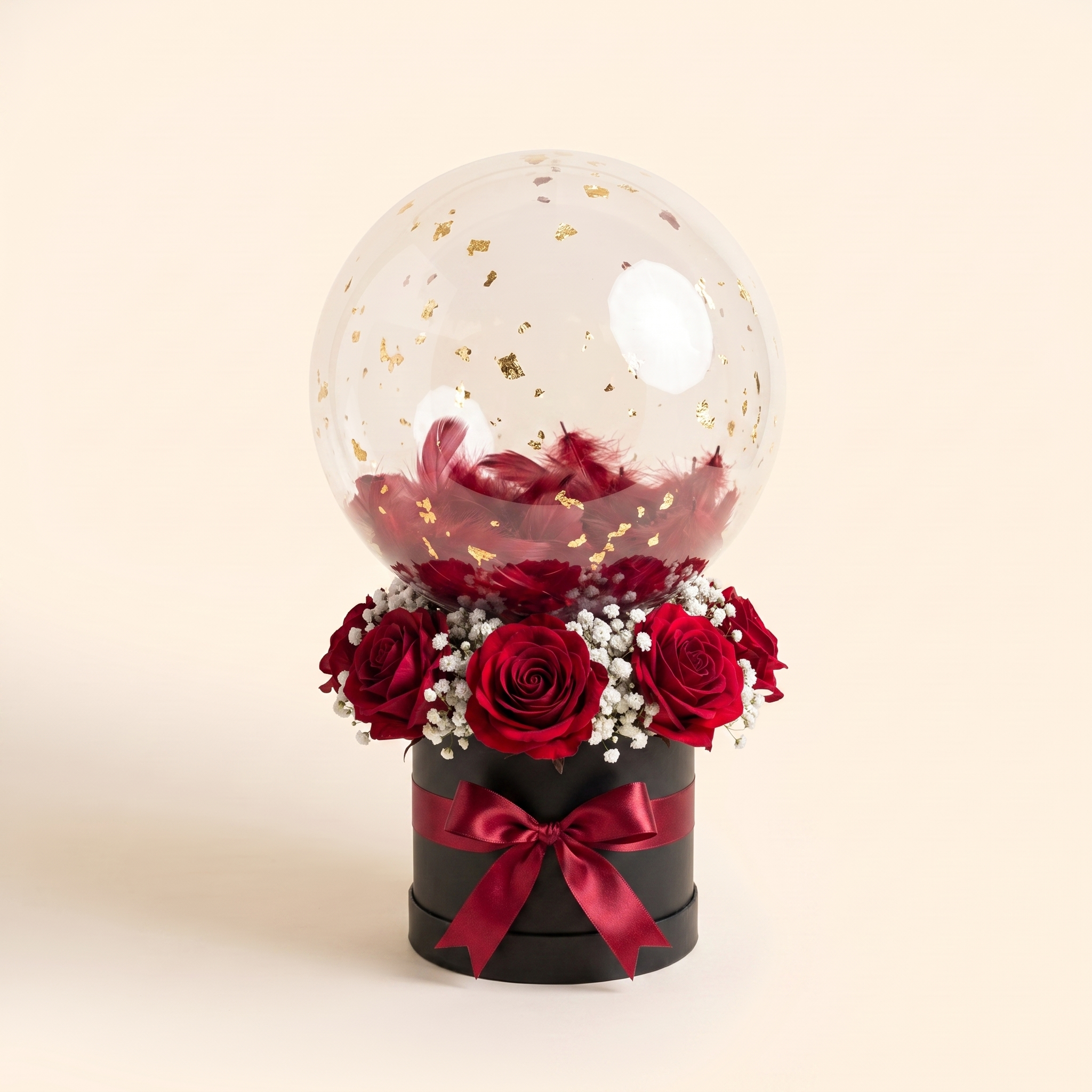 Black box, red roses, gold flakes
