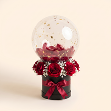Black box, red roses, gold flakes